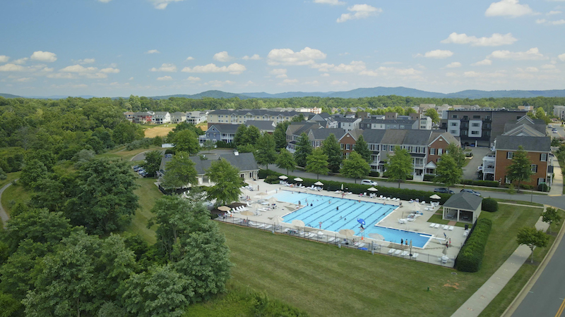 Swim Club at Old Trail in Crozet, VA, featuring a relaxing pool and scenic outdoor views