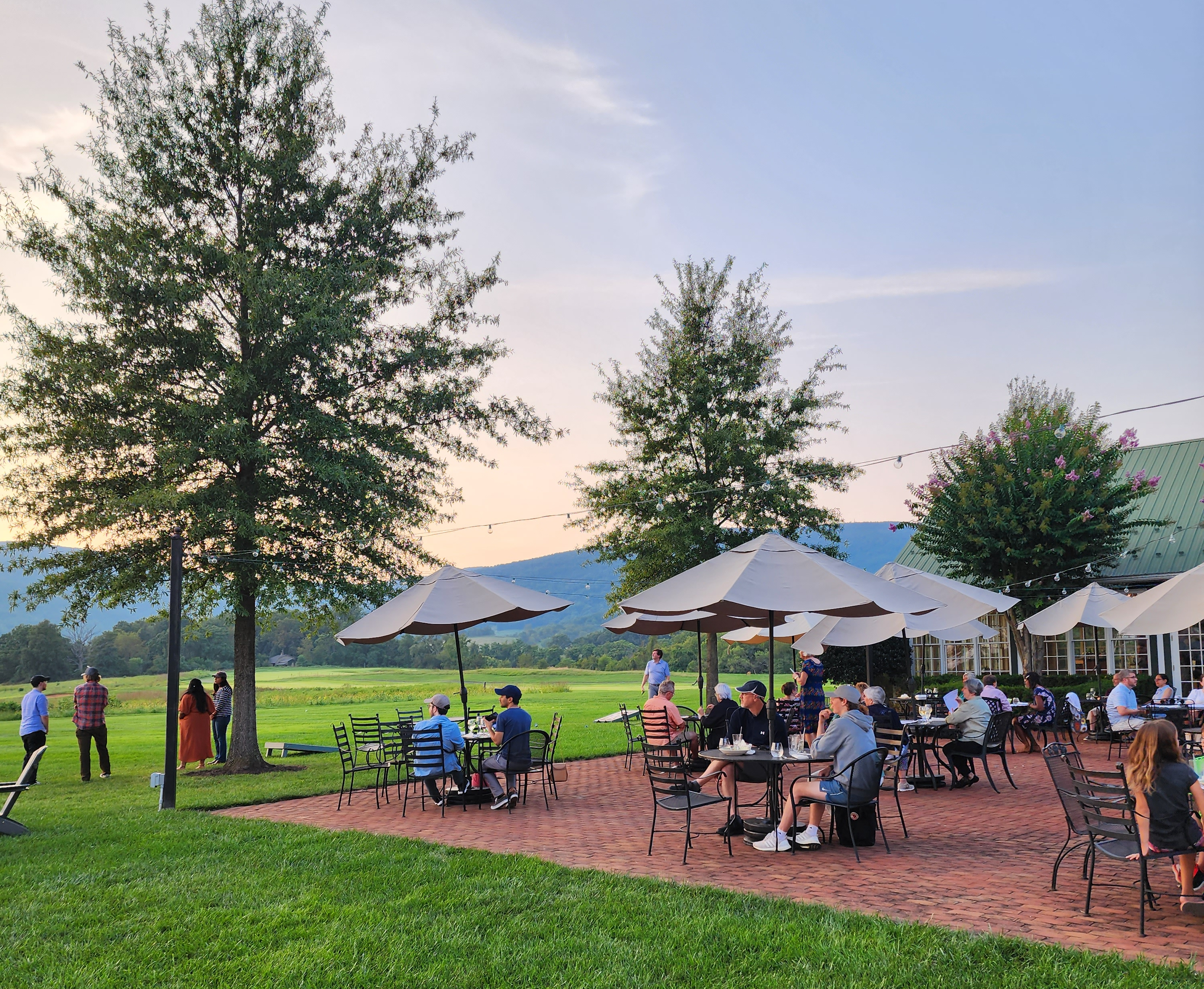 Family enjoying a meal at the fine dining restaurant in Old Trail Golf Club in Crozet, VA